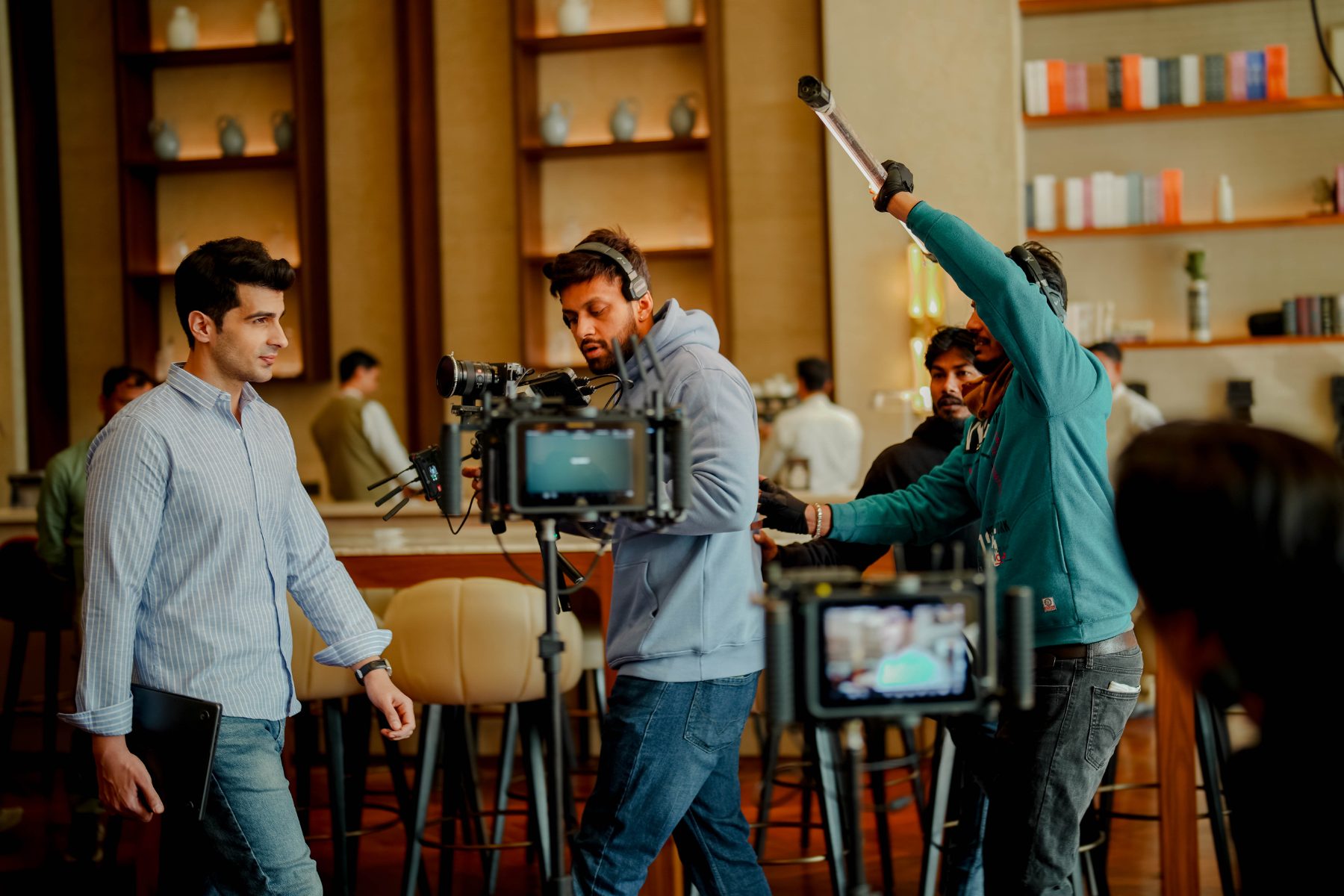 Behind the scenes at Elevate Residency: Director and camera at the library bar