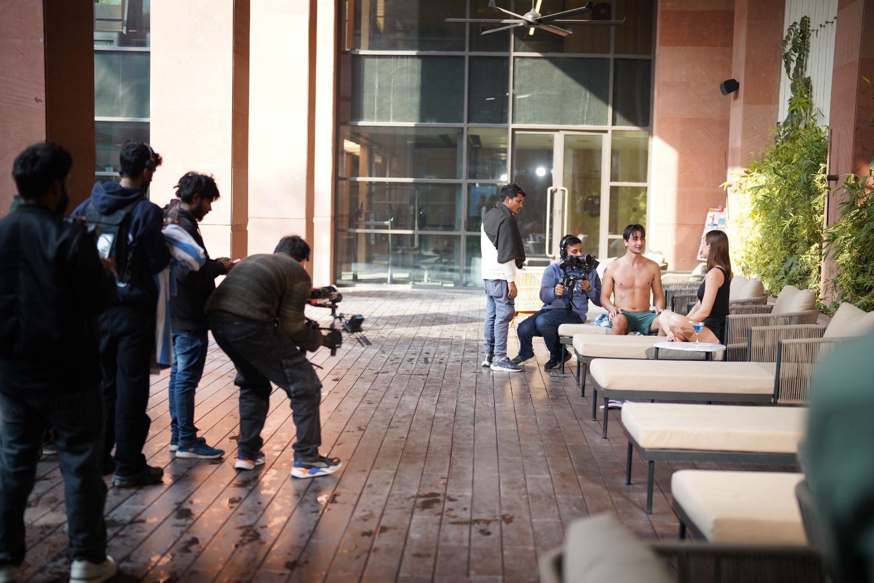 Behind the scenes at Elevate Residency: Crew on the pool deck at golden hour