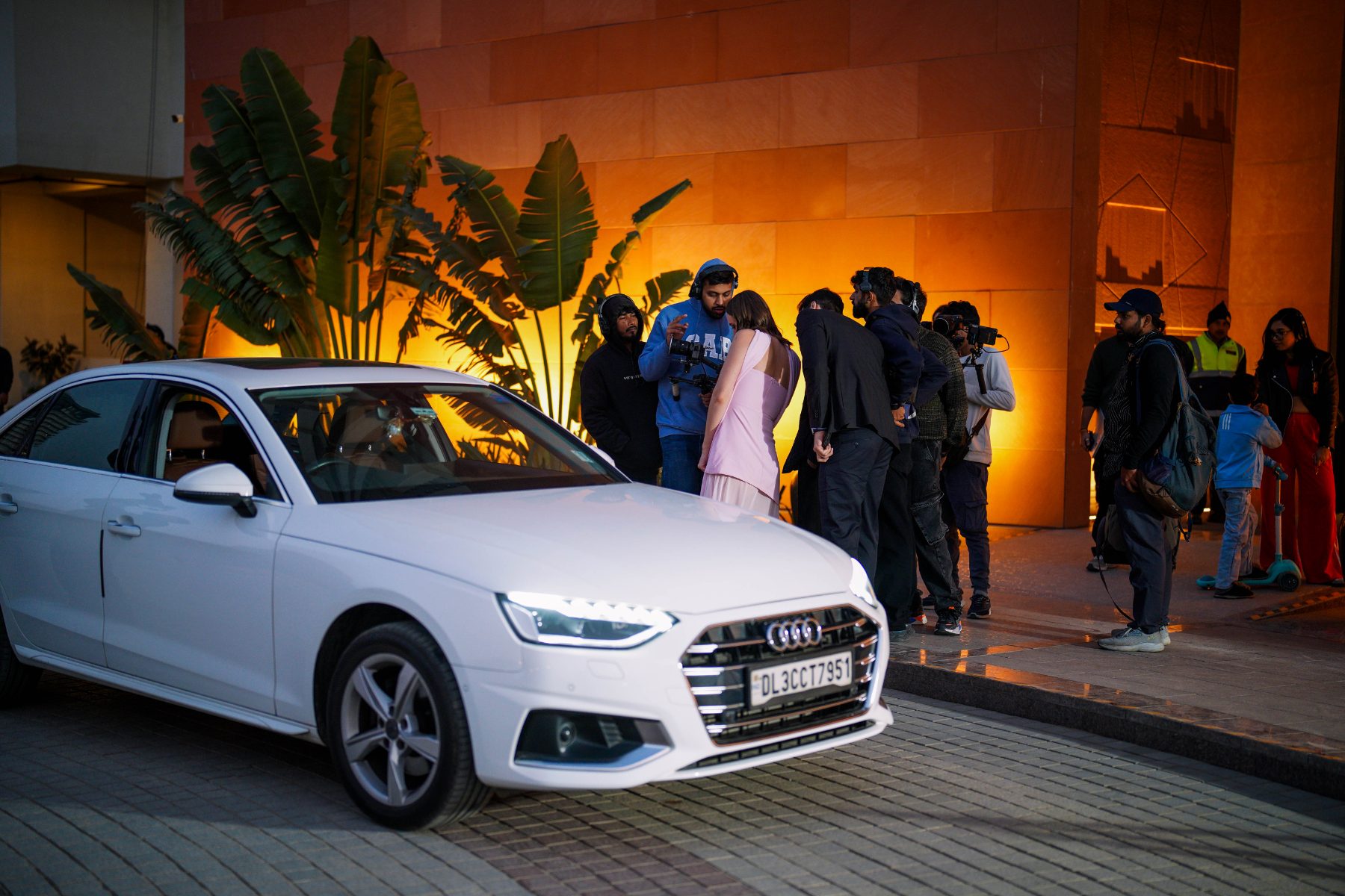 Behind the scenes at Elevate Residency: The arrival scene, crew around the car at night