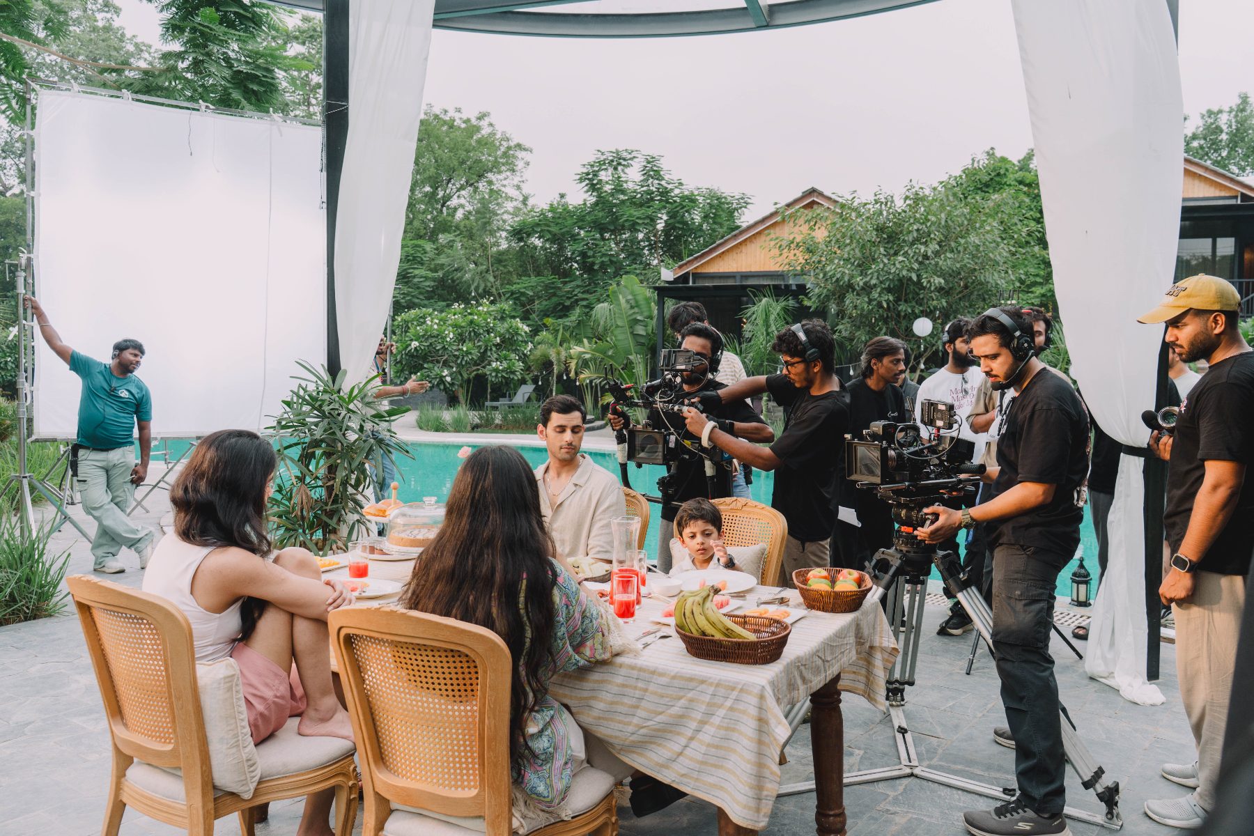 Crew filming the breakfast scene by the pool