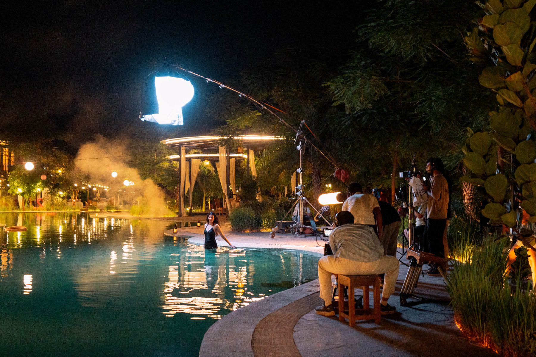 Night pool setup with a boom and lights