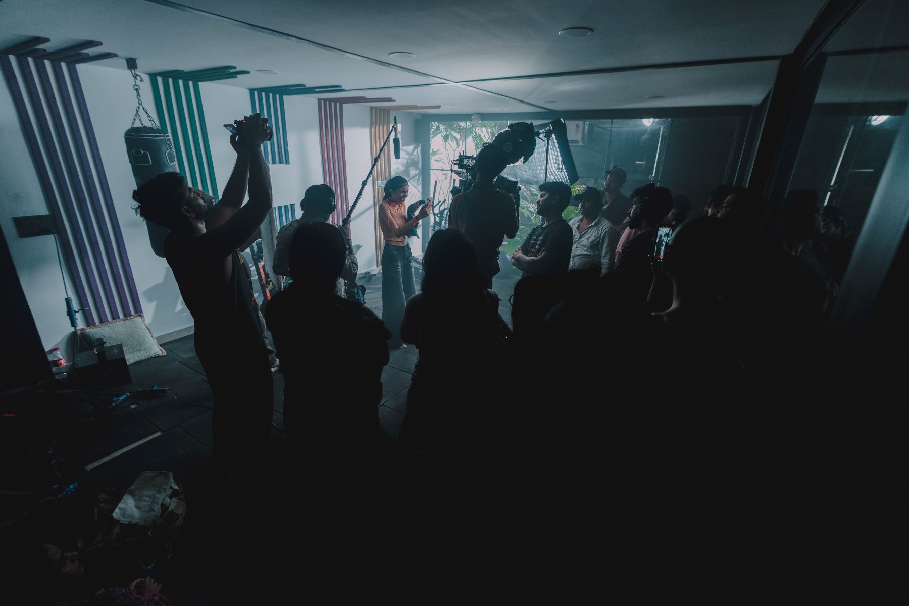 Crew silhouettes on the night set