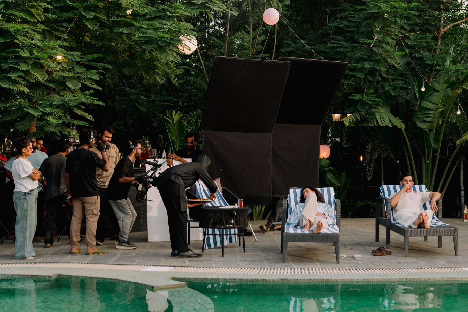 Camera and flags at the poolside lounger